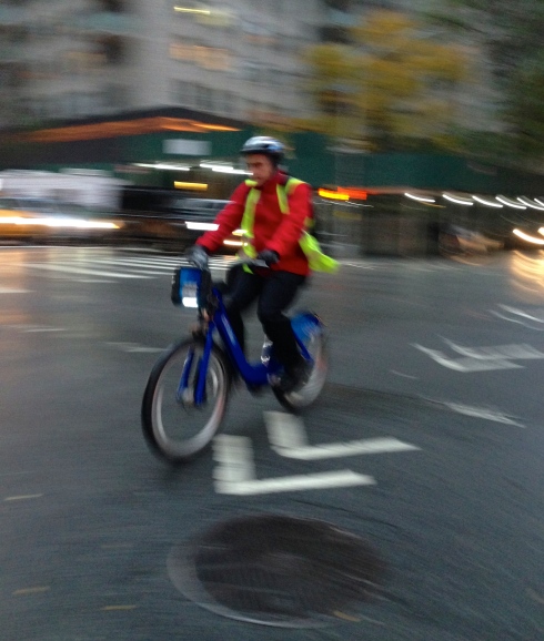 bike rider in the rain, NYC